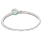 Round green emerald sterling silver ring with a minimalist design, showcasing sparkling gemstone accent.